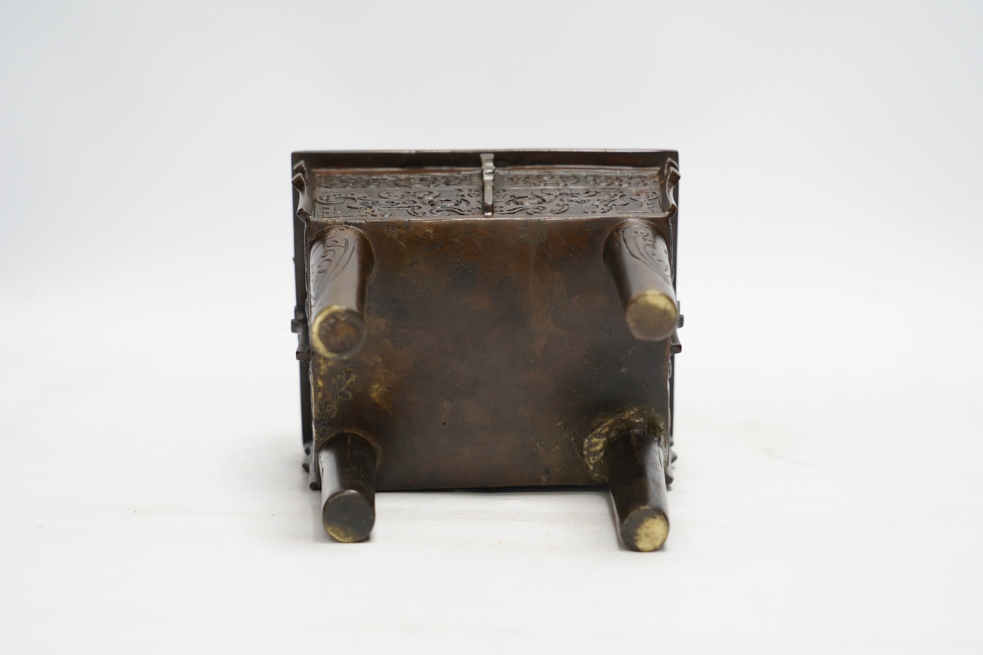 A Chinese archaistic bronze censer, fangding, Ming dynasty, repairs, 20cm